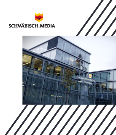 Modern glass building with SCHWÄBISCH.MEDIA lettering on the facade